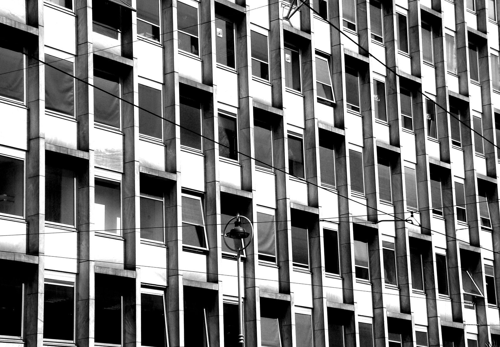 the black and white image of an office building