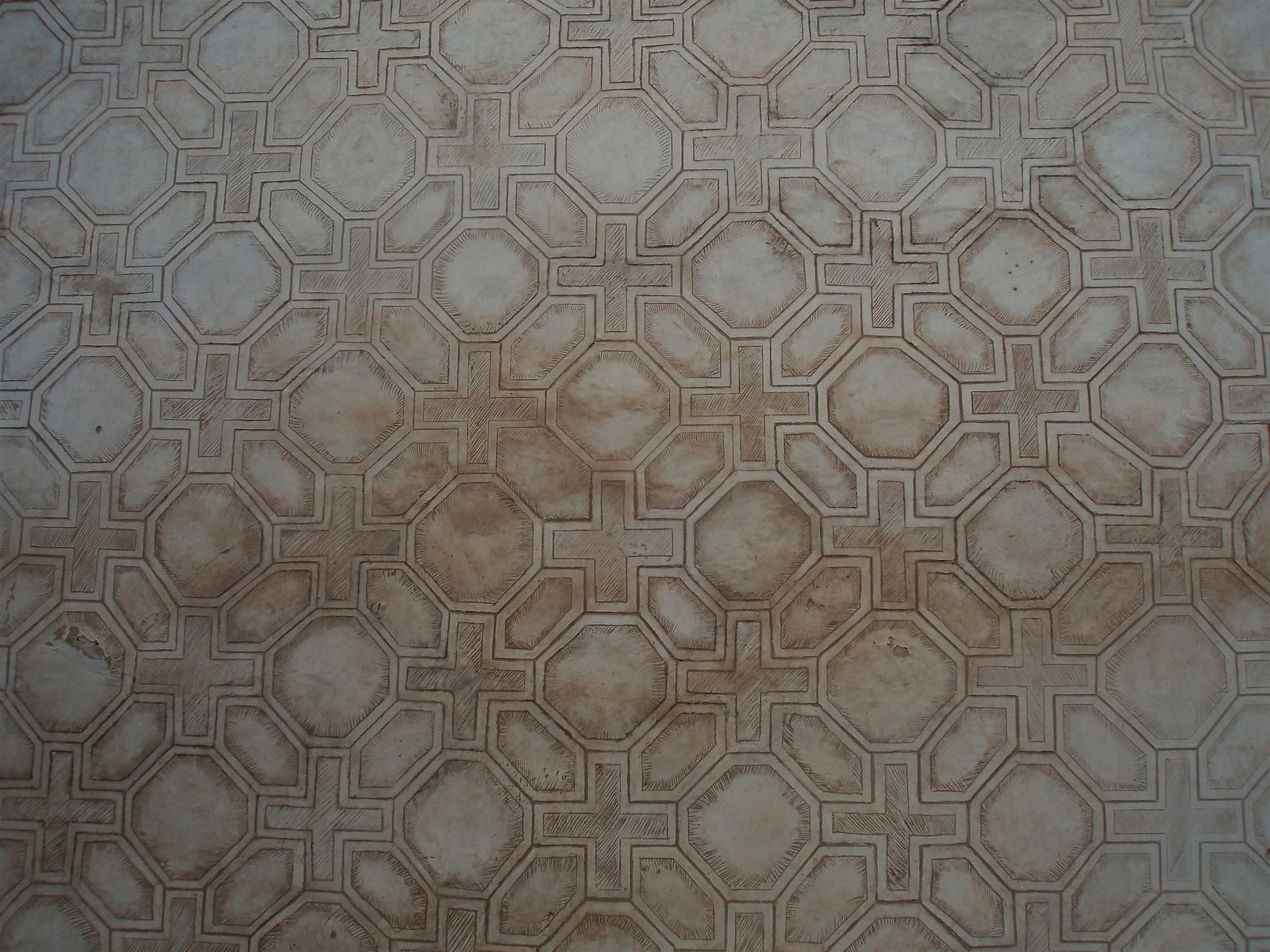 a cement tile design, with square shapes