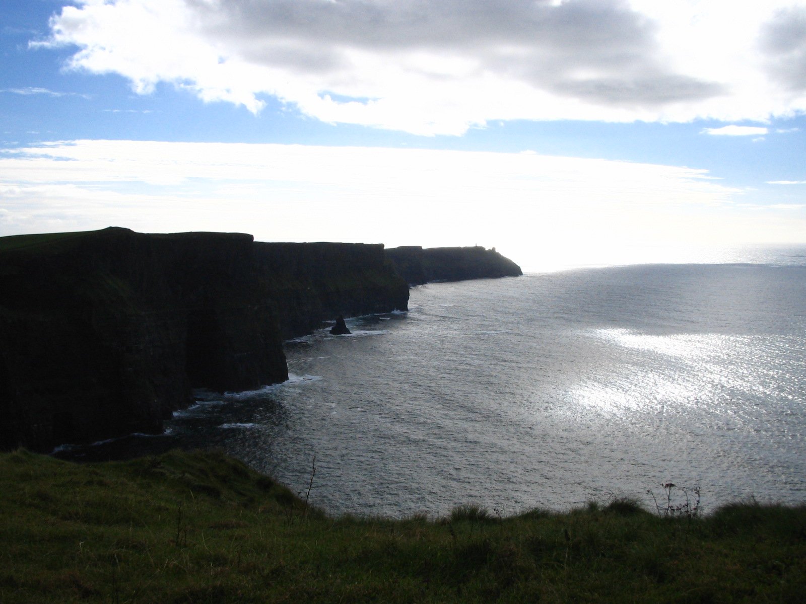 there is a long line of cliffs that extends off into the ocean