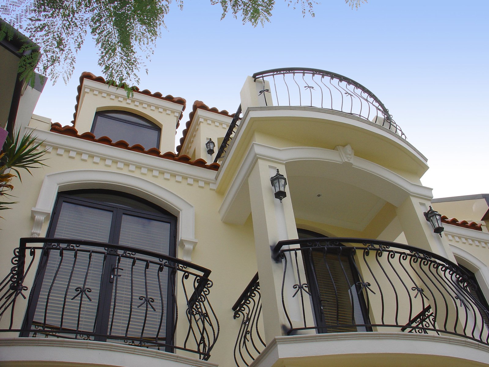 balcony railings on a front side of an upscale house