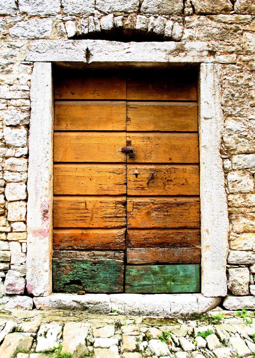 an empty door with stone and wood in it