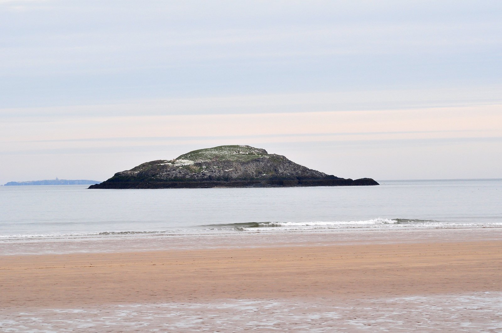 a small island off the coast near a beach