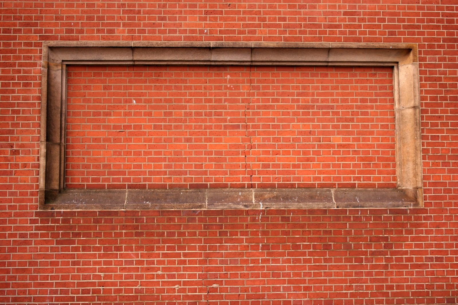 a clock sitting on the side of a brick building