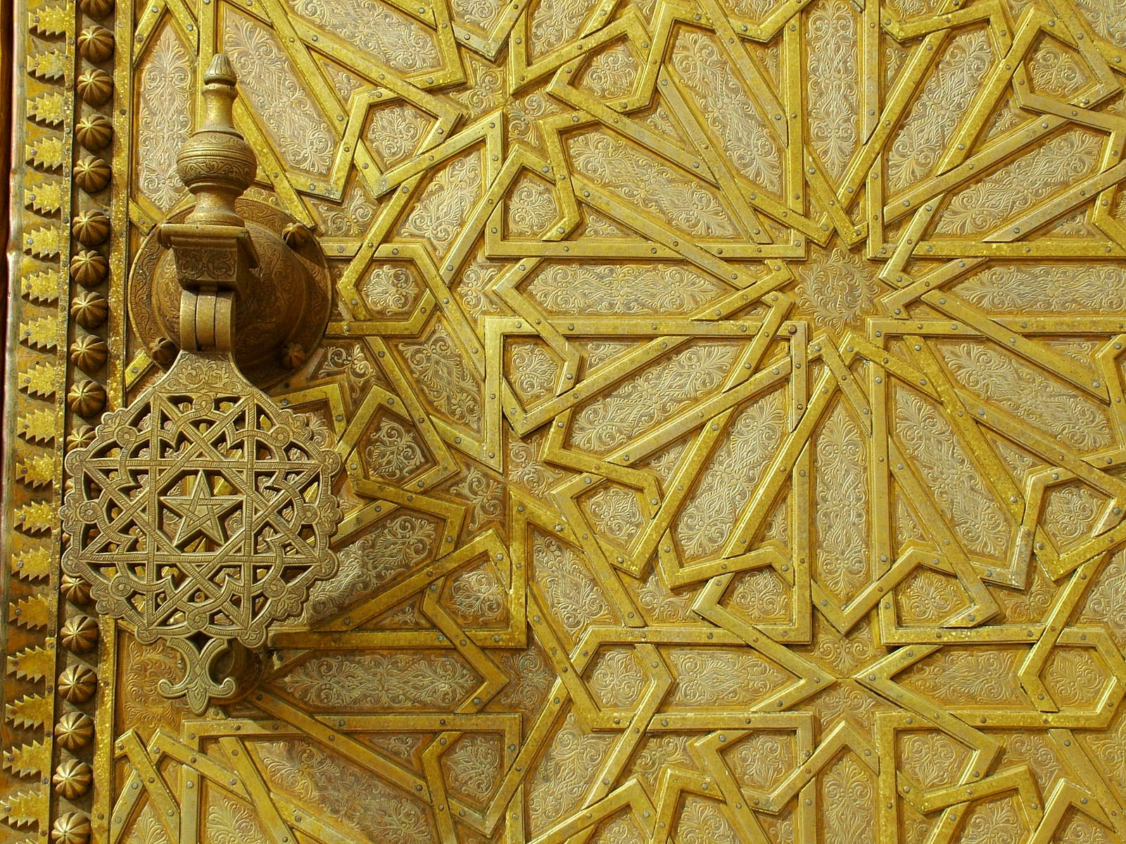 gold intricate design with a fire hydrant in the center