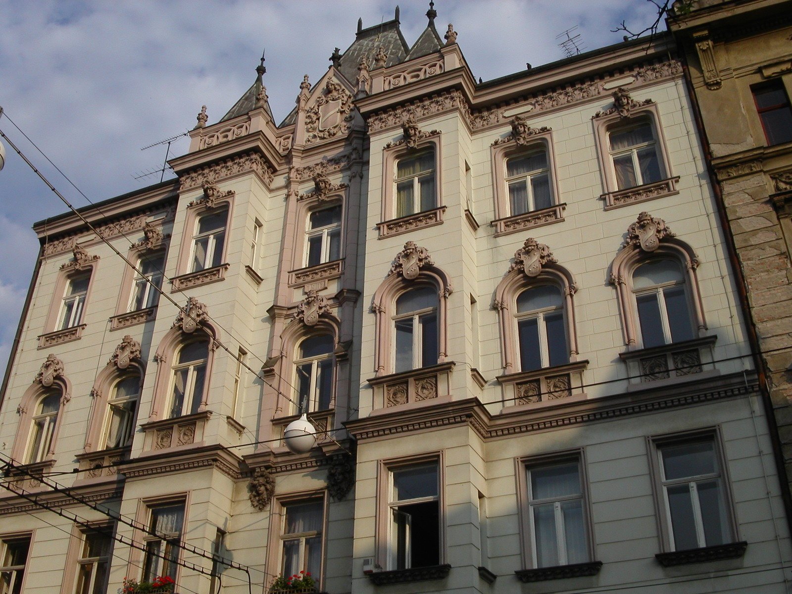 old building in a city with a clock on the corner