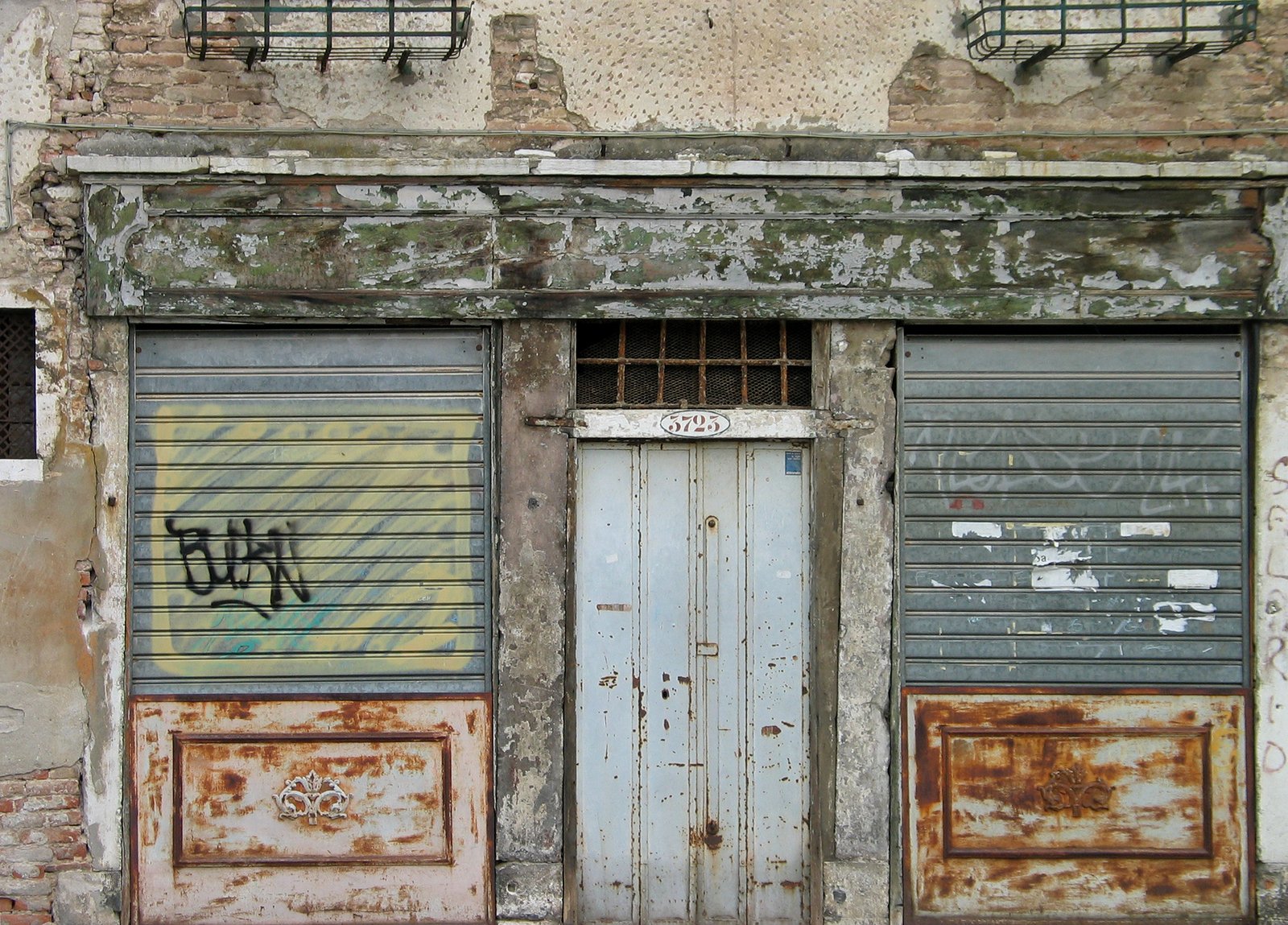 there are two garage doors in front of the building