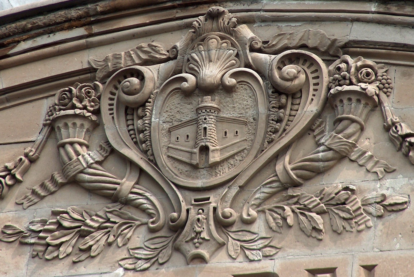 an old building with decorative crest carving on it