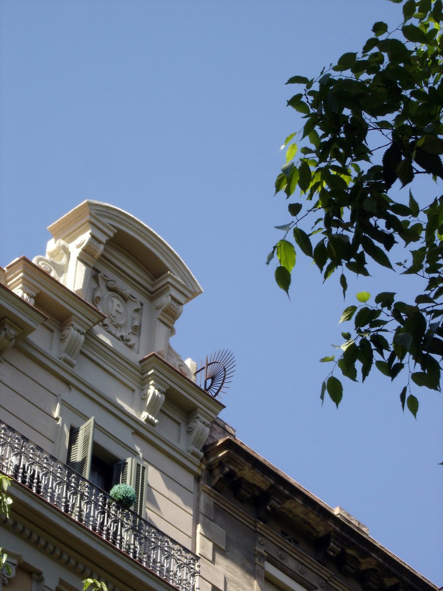 an ornate tower on the front of a house