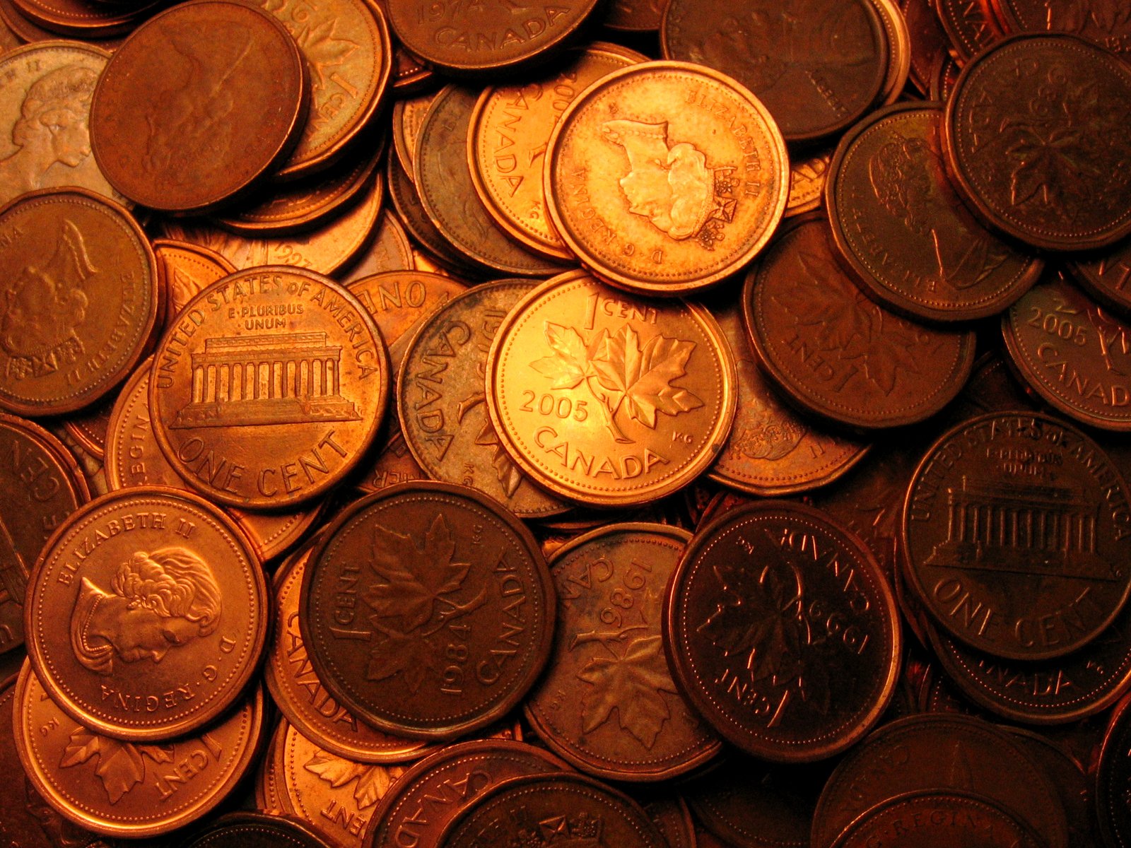 a pile of copper coins sitting on top of a table