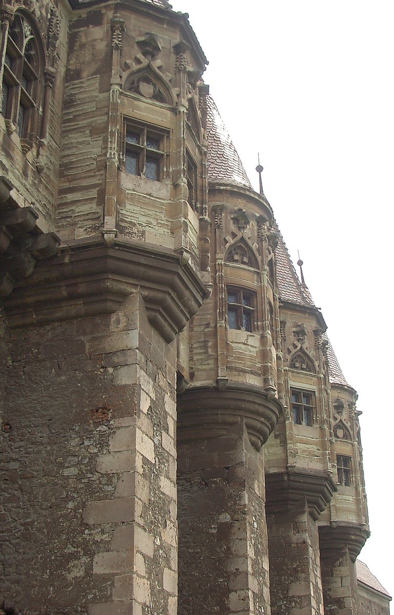 a group of old stone buildings with ornate architecture