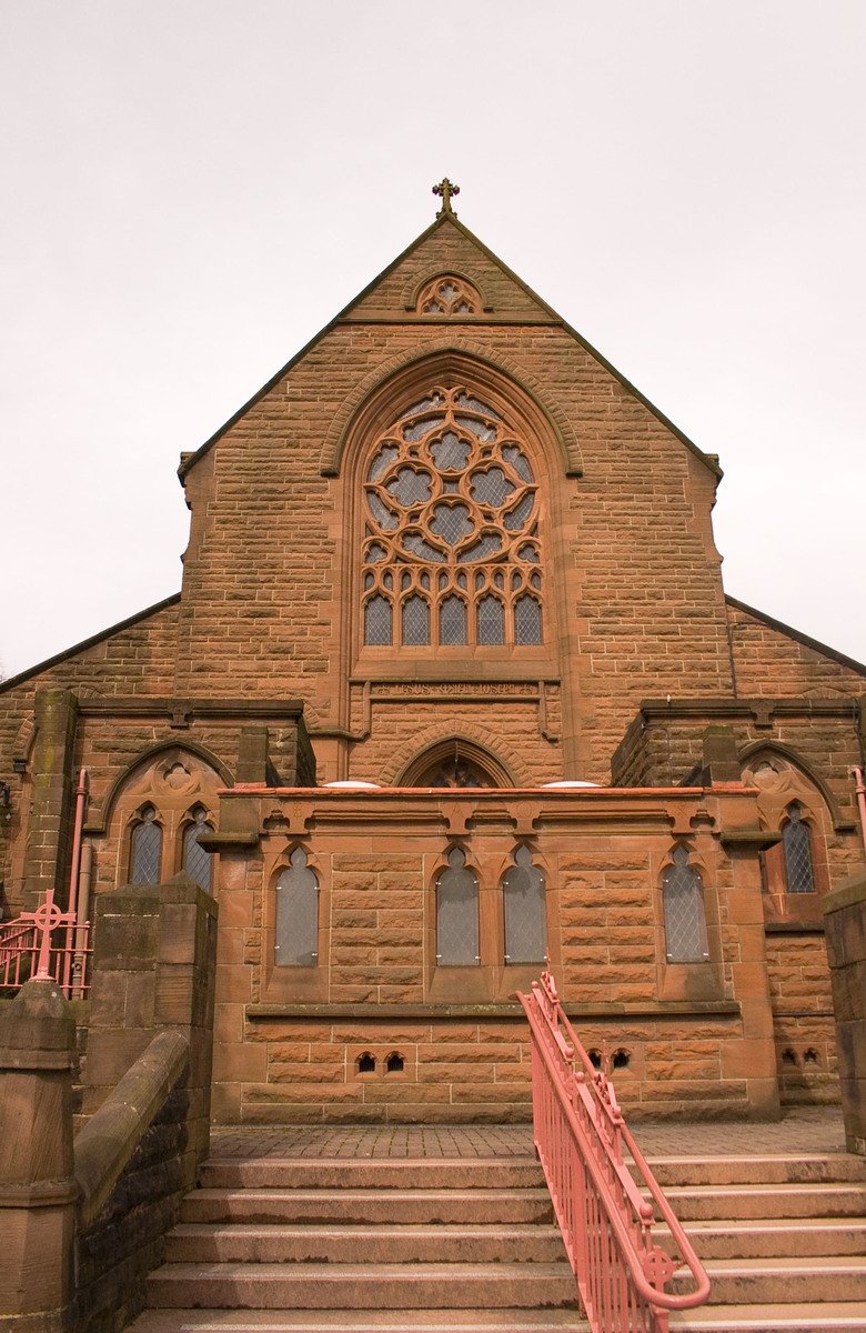 stairs lead up to a large stone building