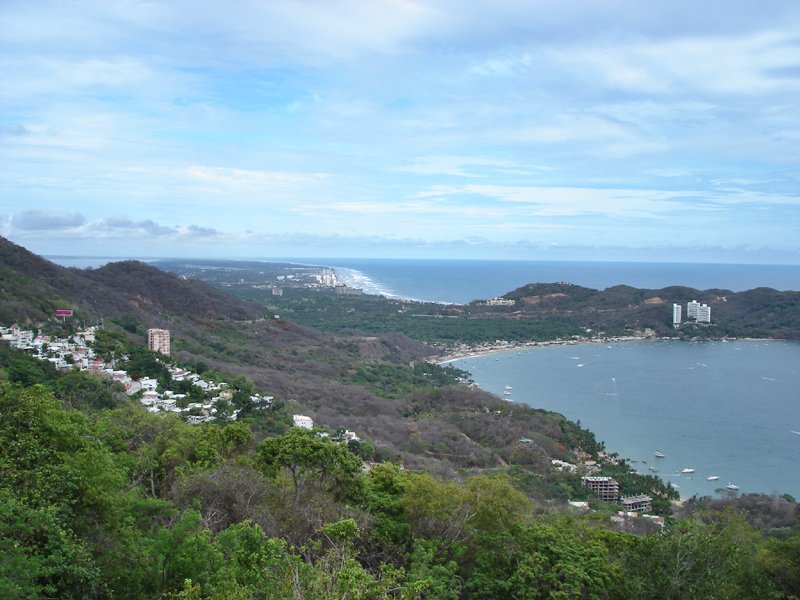 a scenic view of the water, land and a coastal area