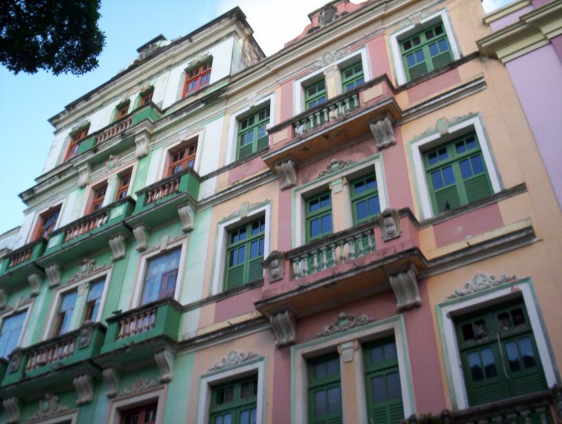the building has green and pink stripes painted on it