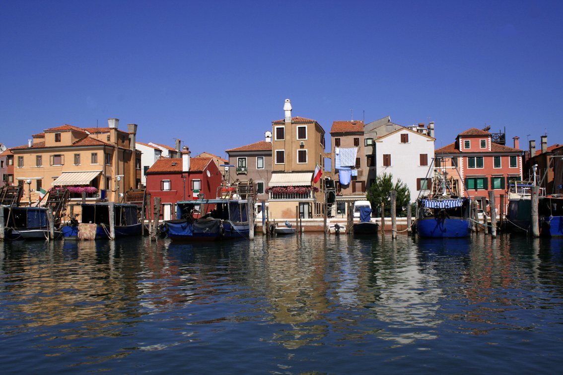 a group of water front homes and a few boats