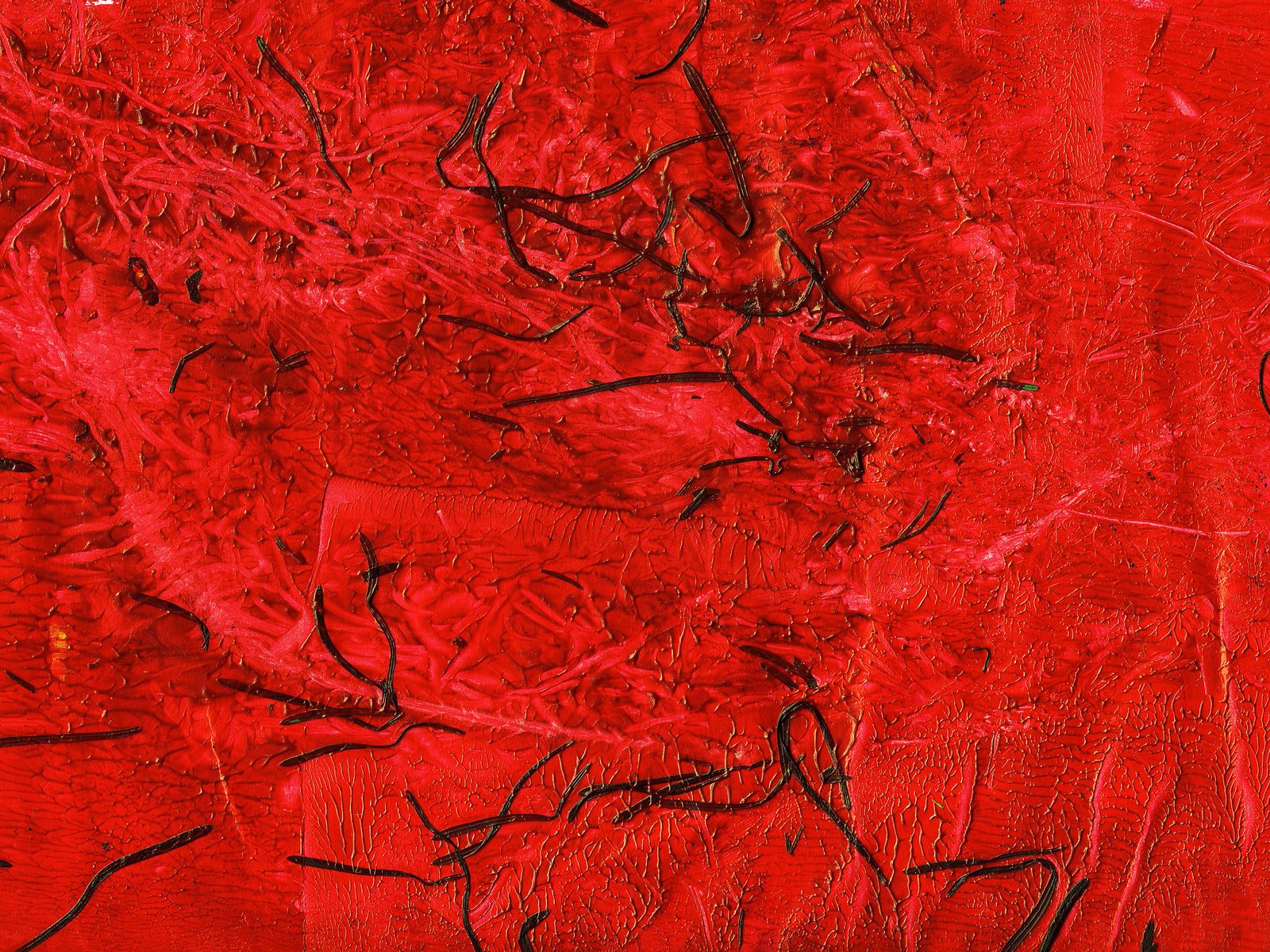 this red painting has a lot of black ink