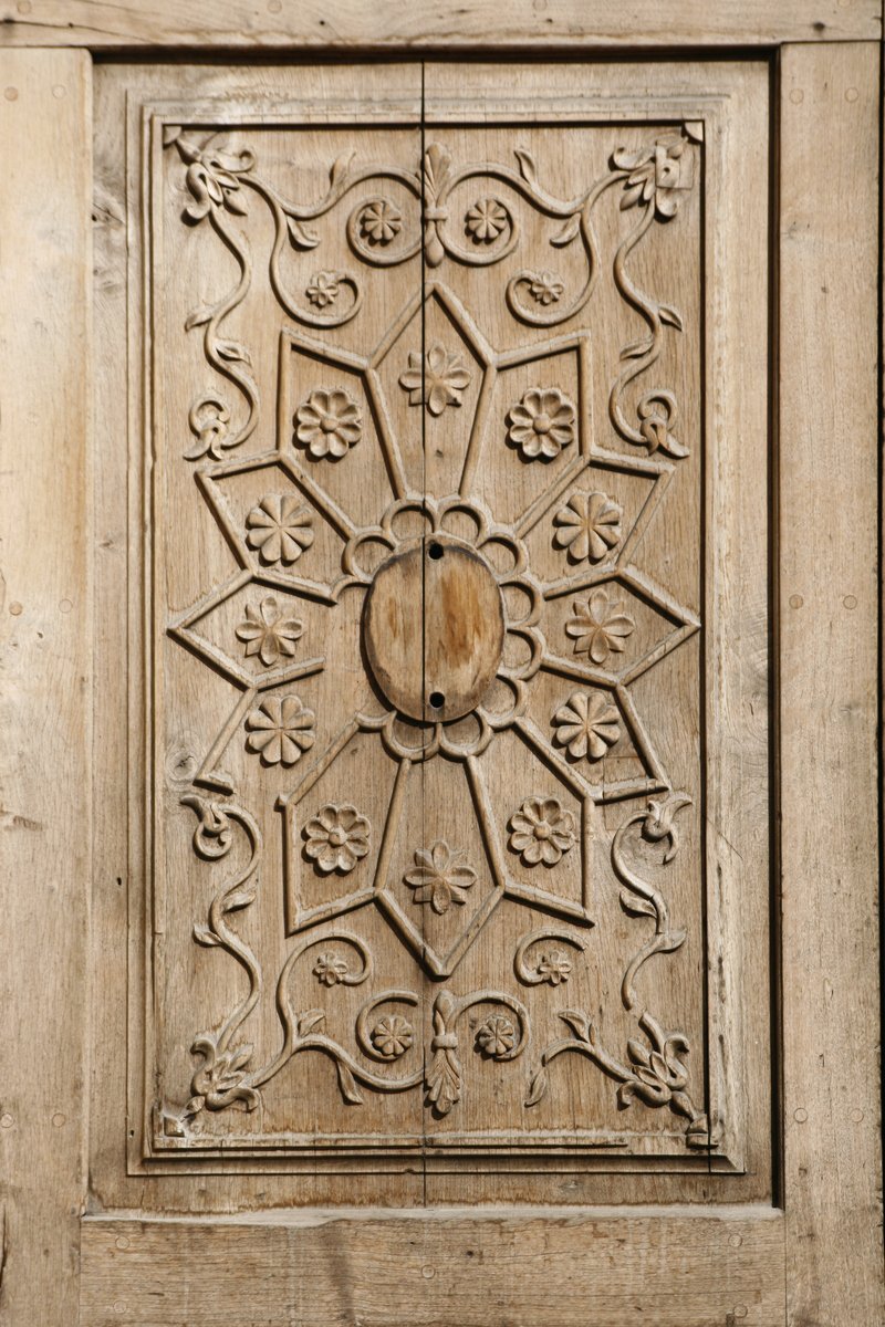 a decorative panel with several flowers is shown