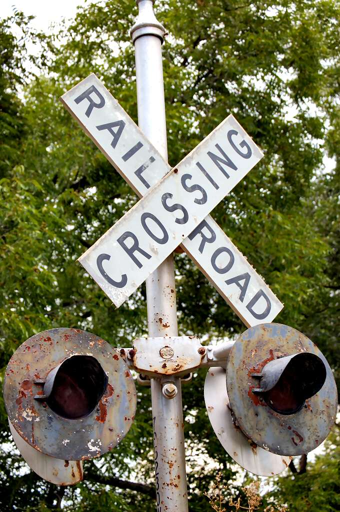 the railroad crossing is made out of metal