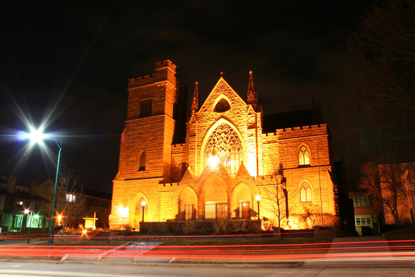 a large church lit up at night time