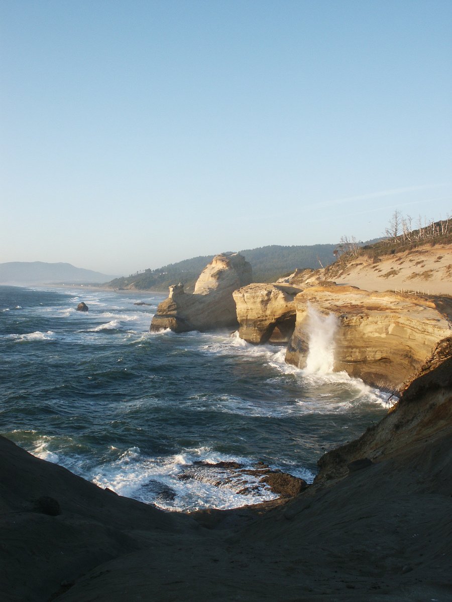 a body of water surrounded by large rocks