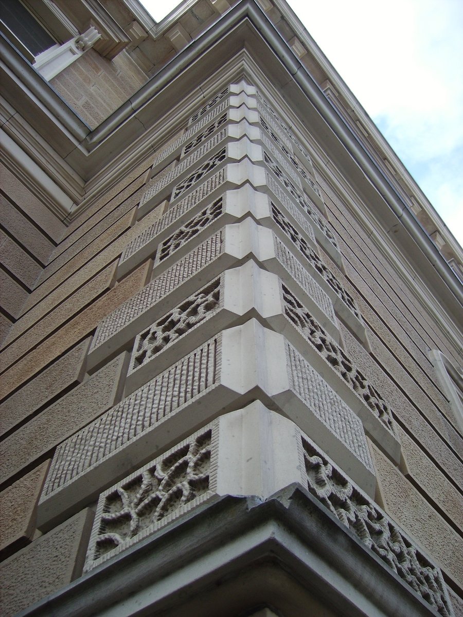 an old building has decorative designs on it