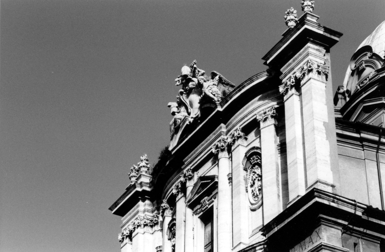 black and white pograph of ornate architecture on side of building