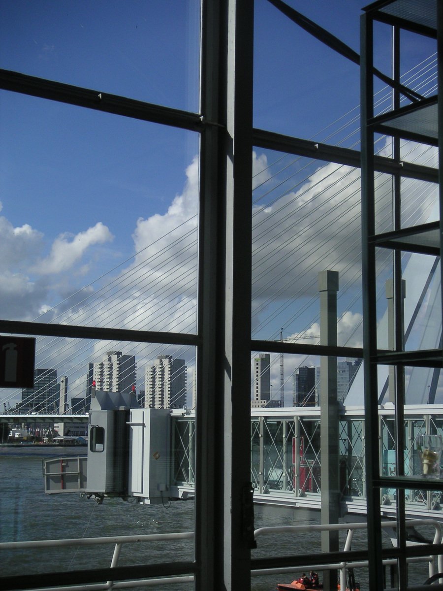 view of a harbor through a large glass window