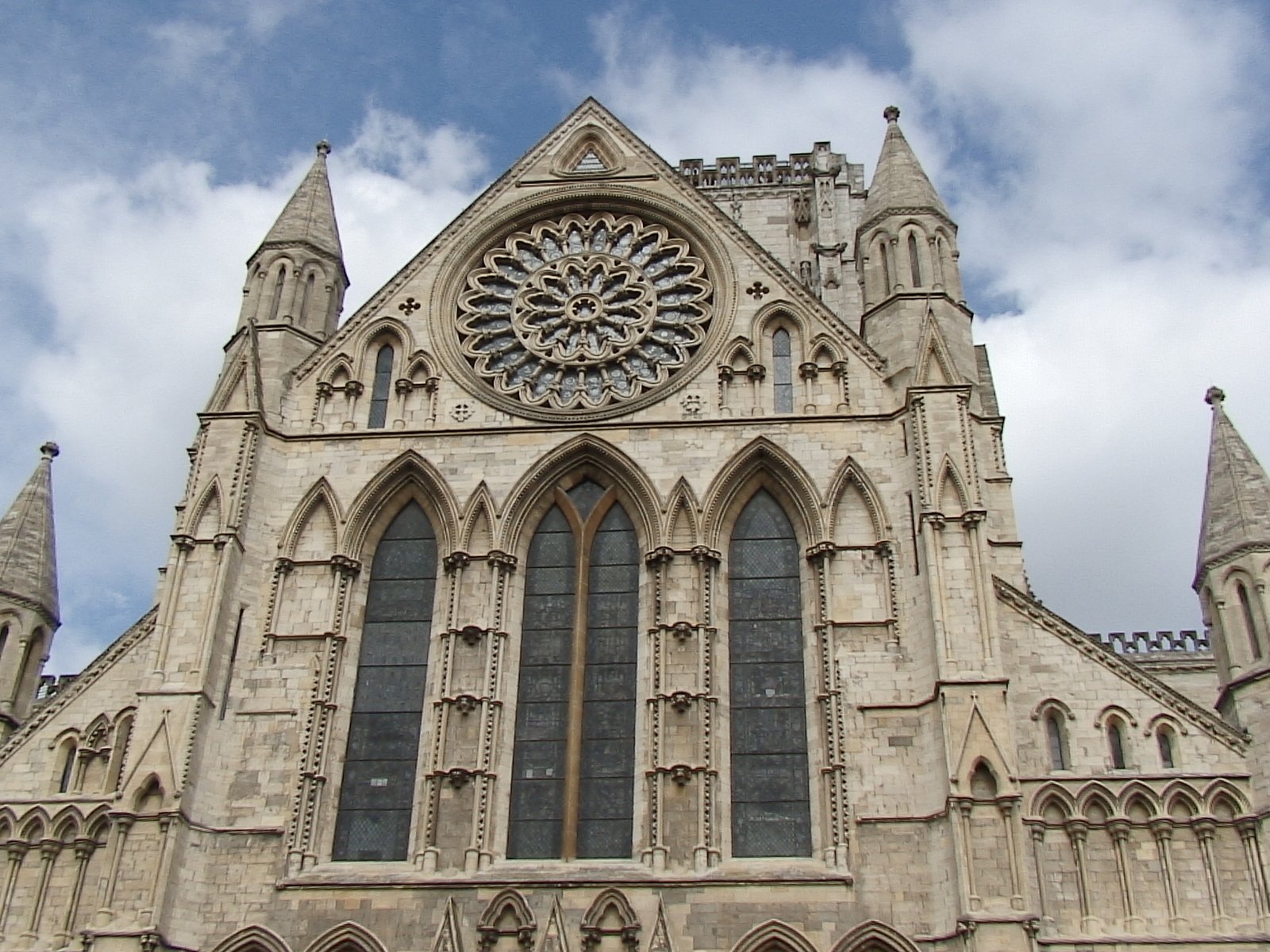 a cathedral with a large circular clock on the side