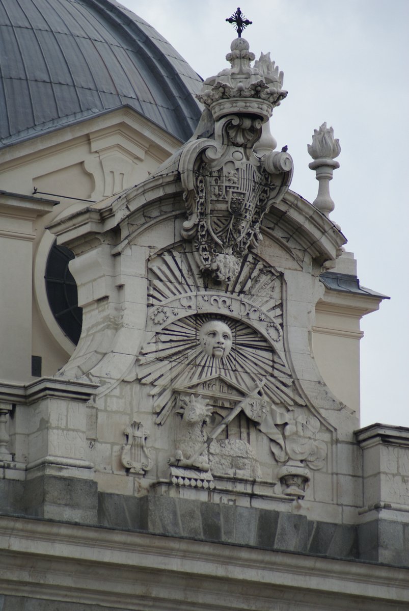 an ornate sculpture on top of a building