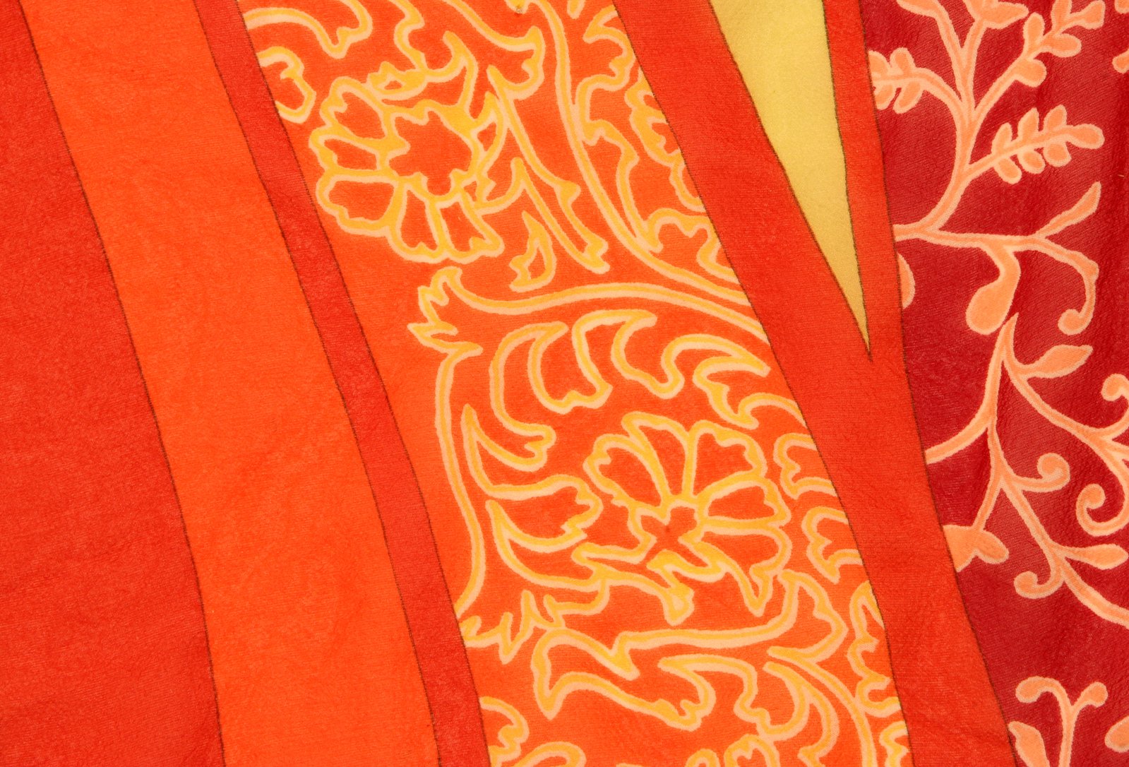 an orange, red, and yellow sari with an interesting design