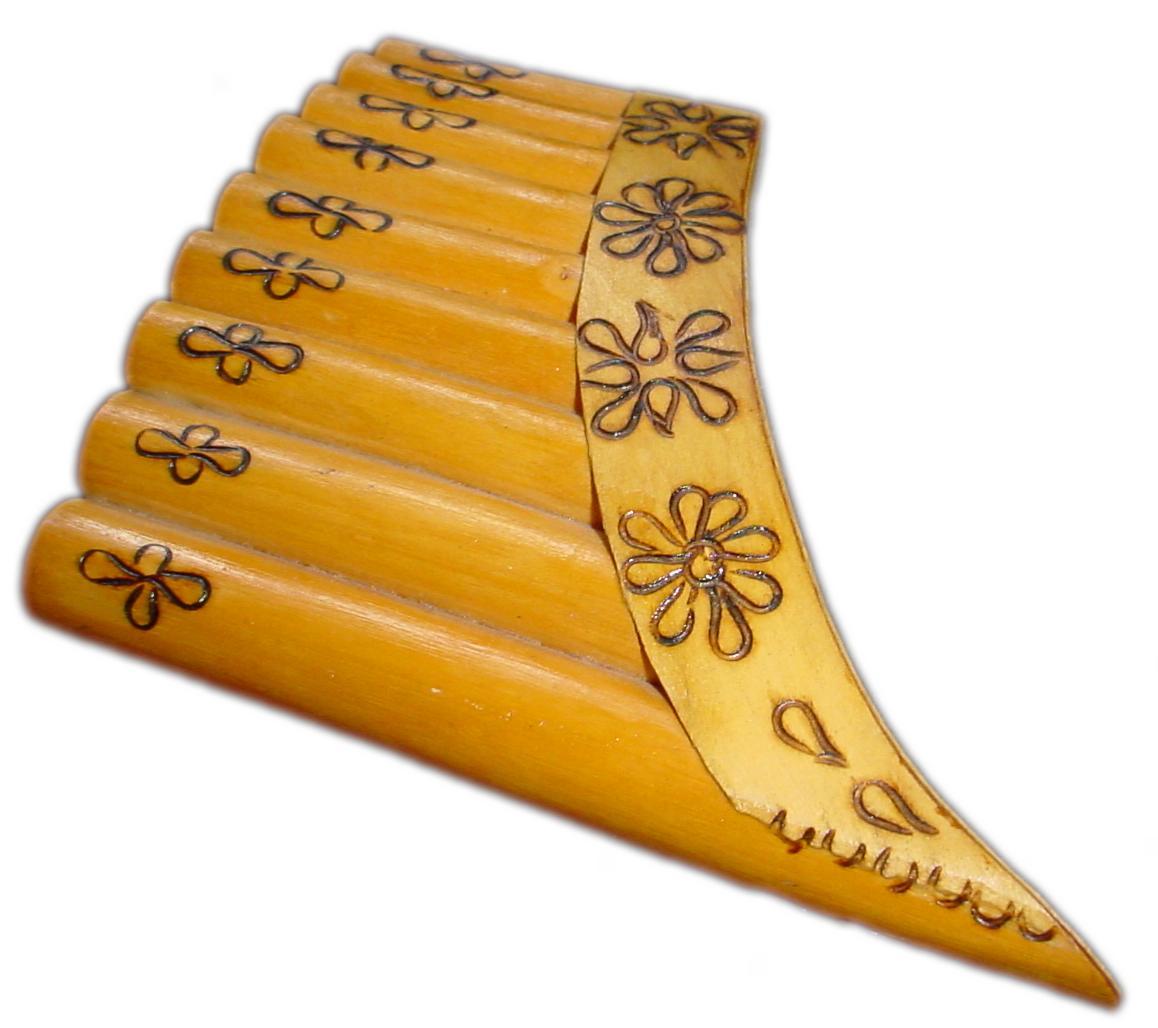 a group of carved wooden wind chimess sitting on a white table