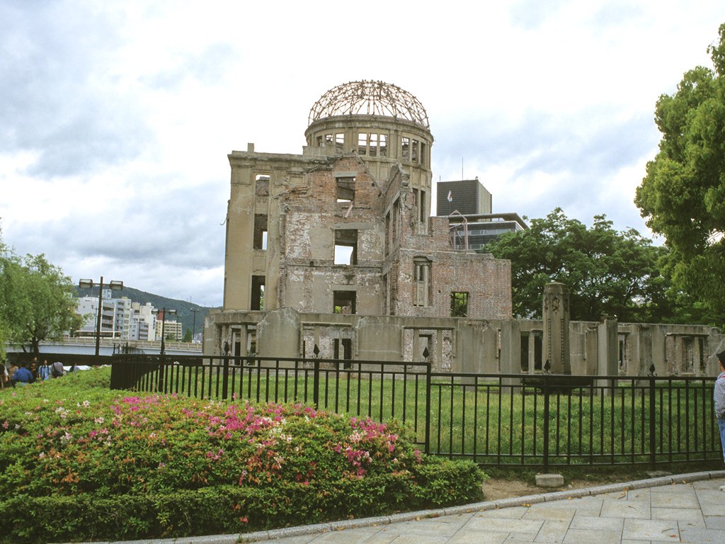 the ruins of a building with many windows and a dome