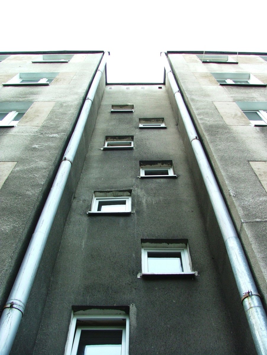the bottom portion of a building with many windows