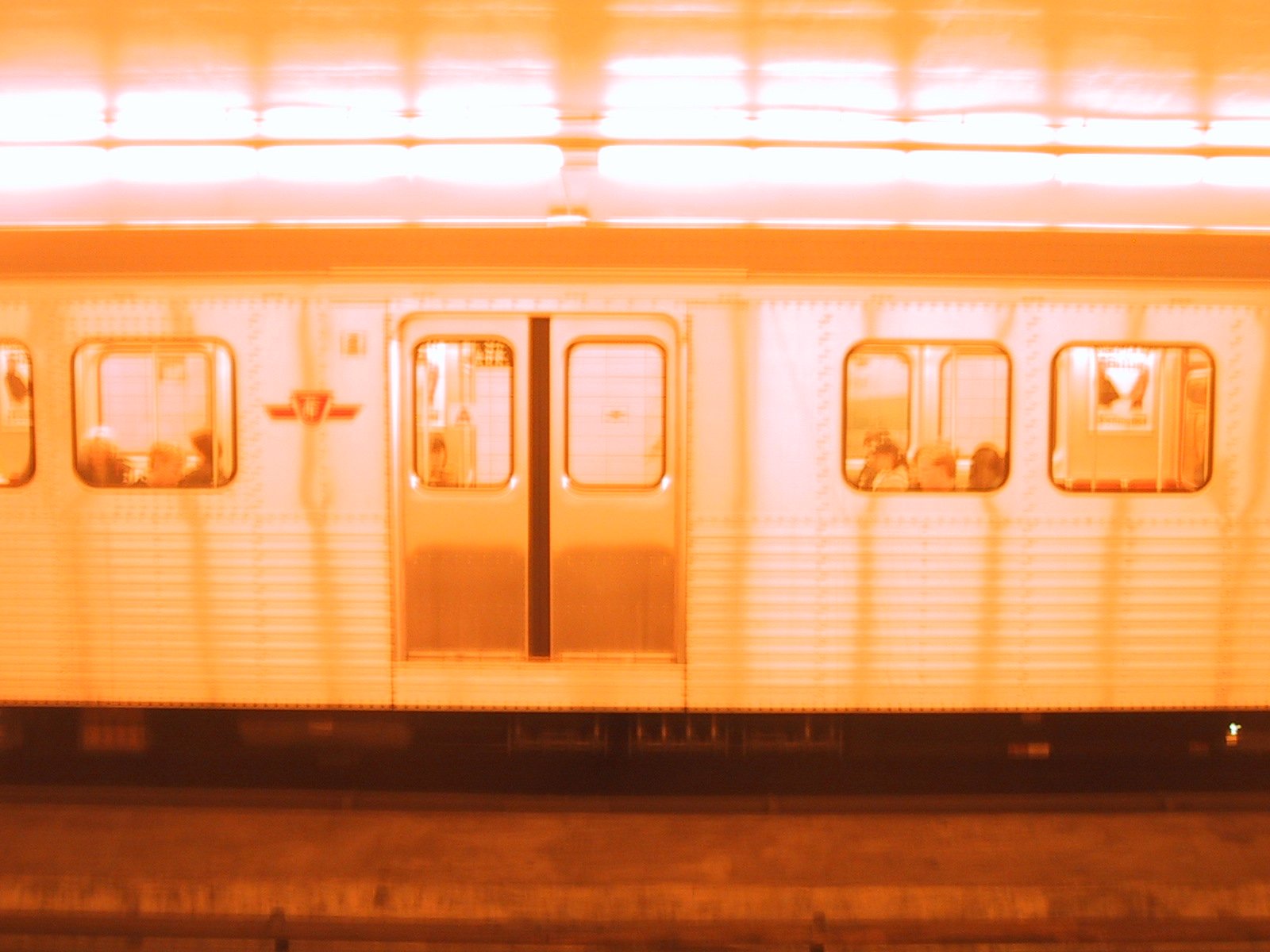 a train is at the station during the night