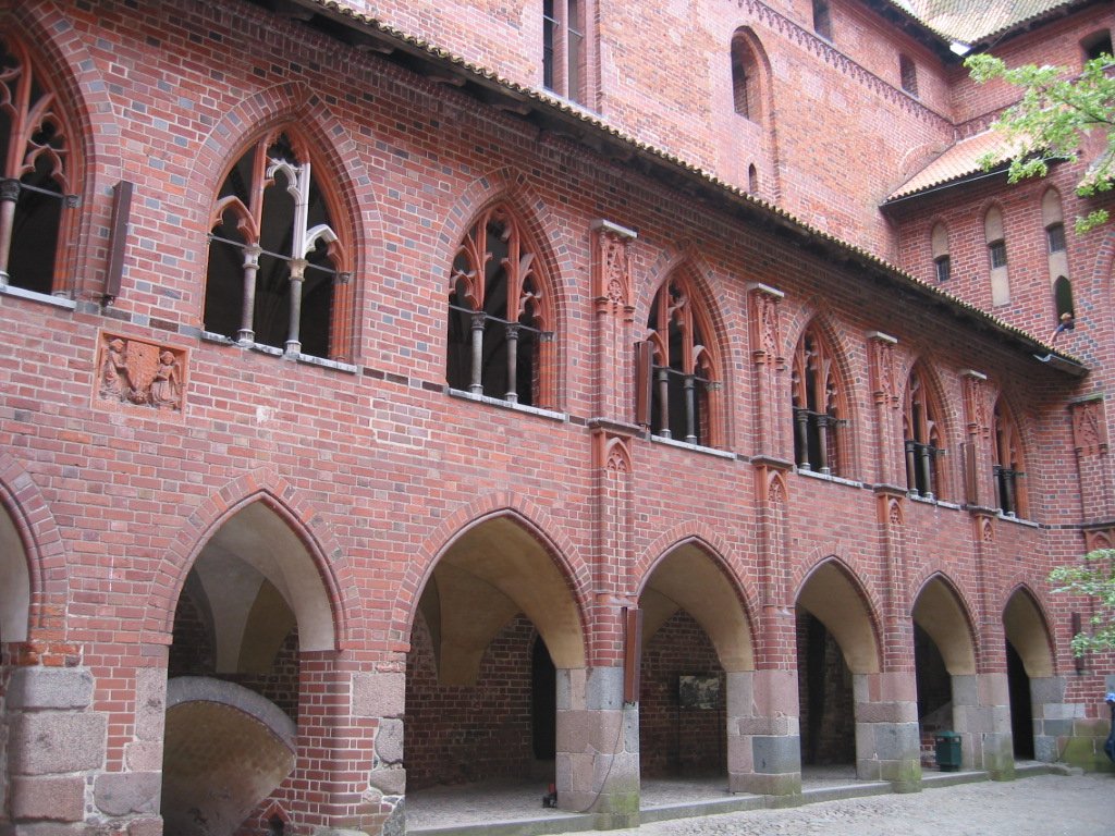 several arches and windows of a large building
