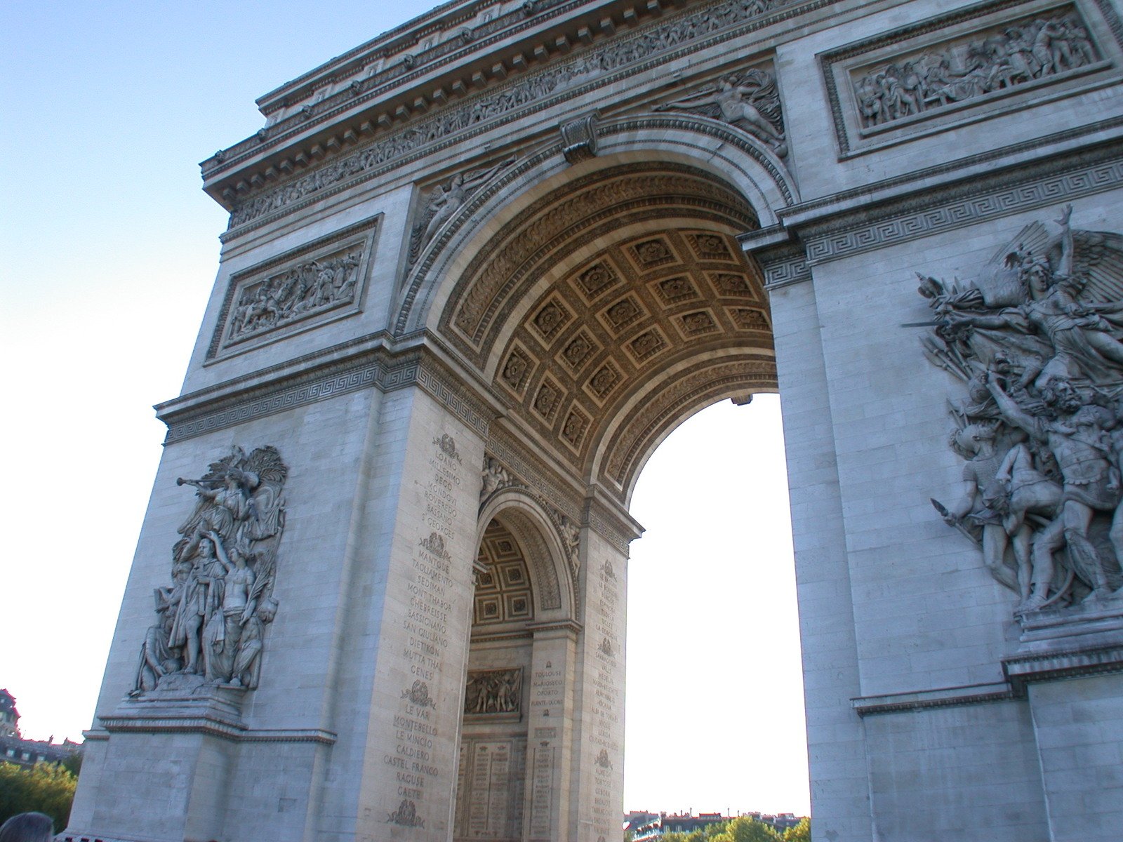 a close up of the stone and stone archways on the facade of a monument