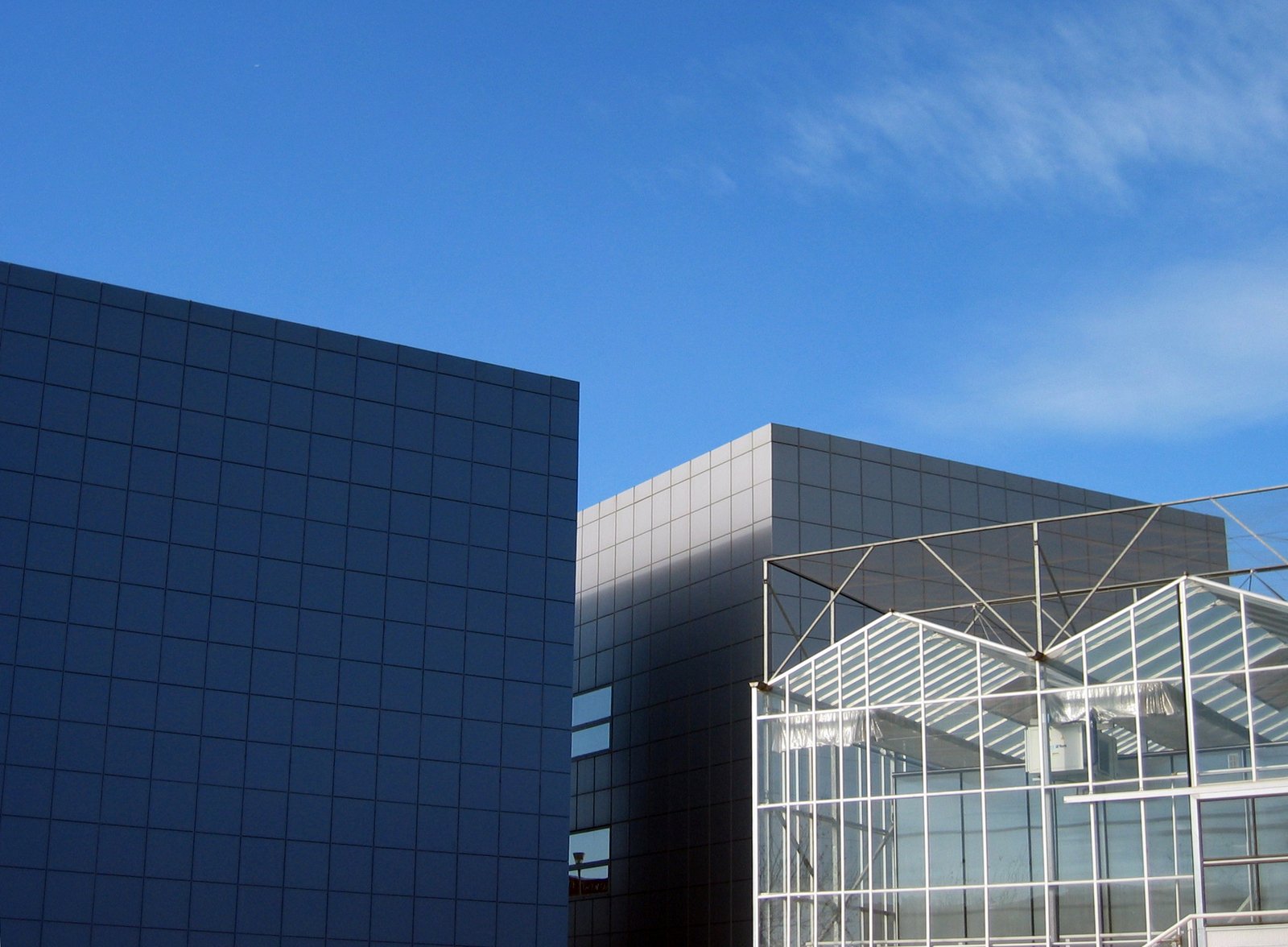 two large modern buildings next to each other