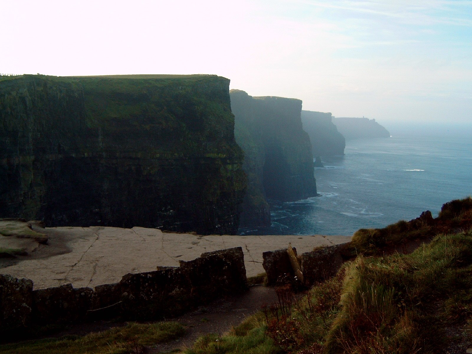 the view from atop the cliffs near a beach