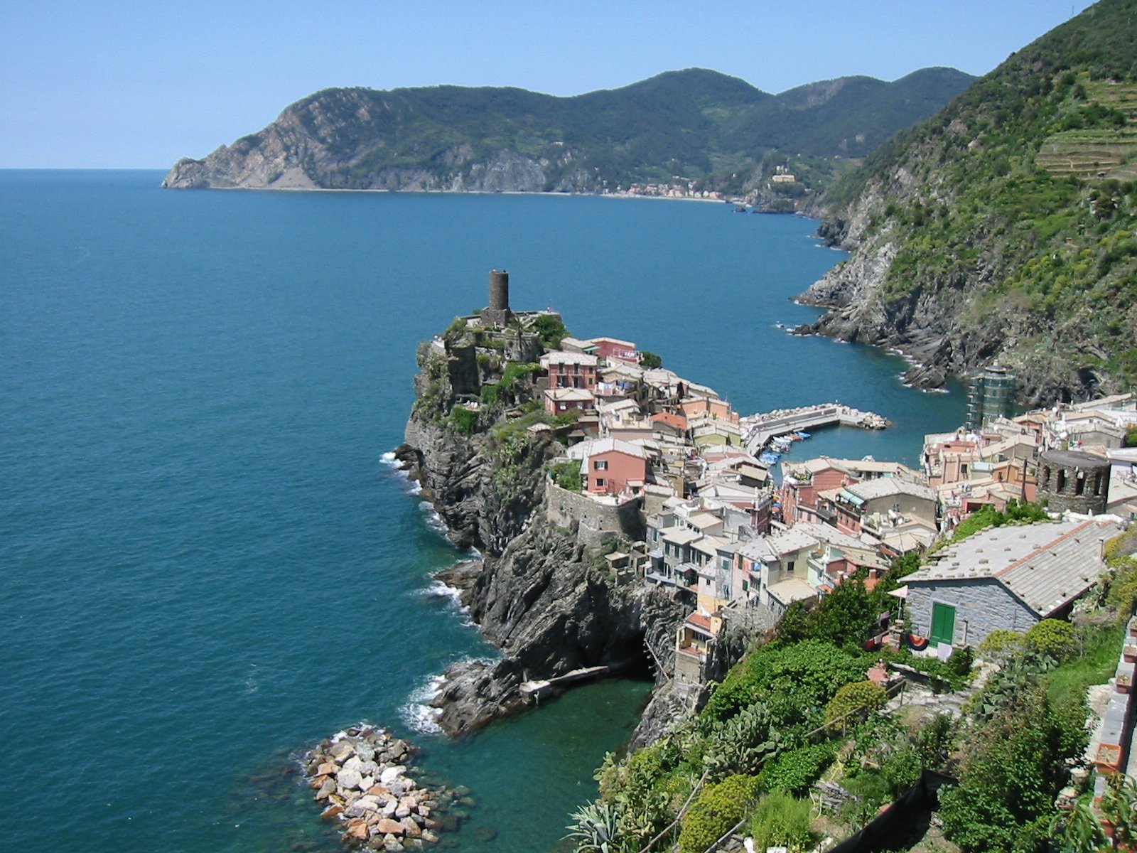 the ocean is surrounded by a beautiful old village