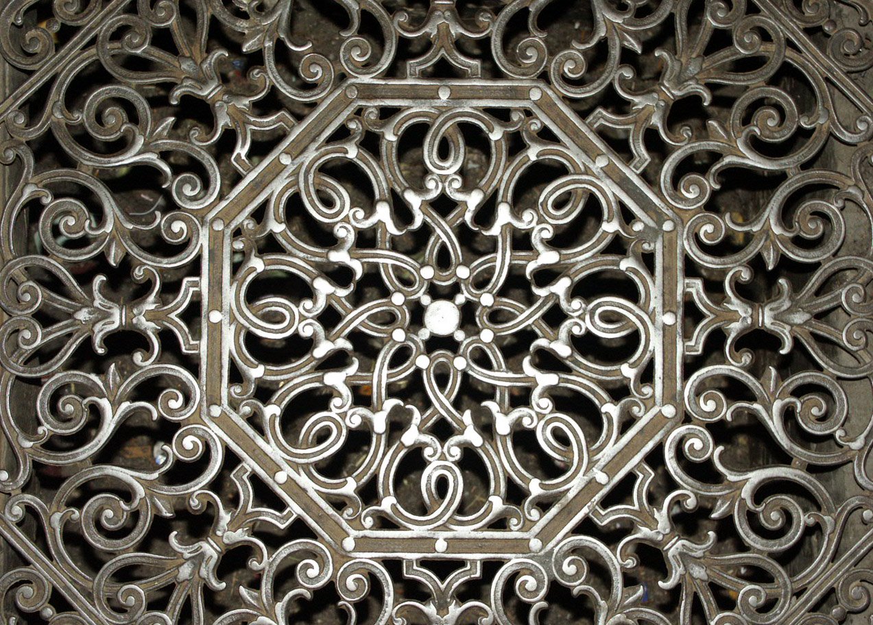 a decorative iron plate for a gate