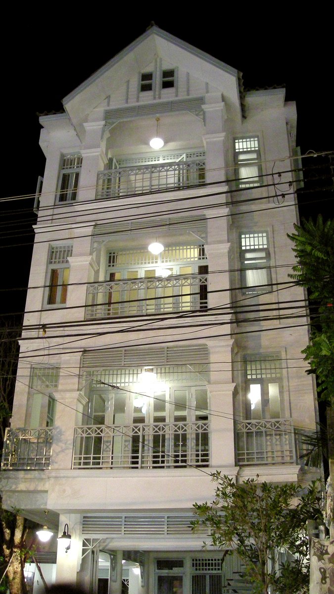 a large white building at night with lights