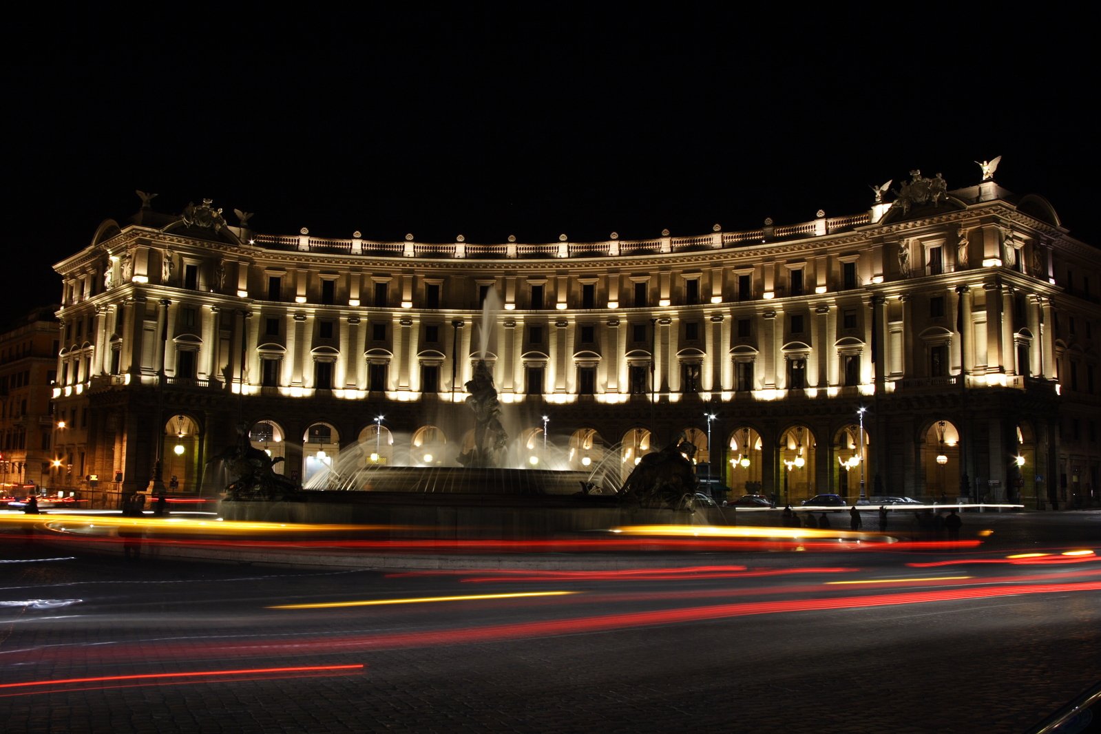 large building with lights shining in front