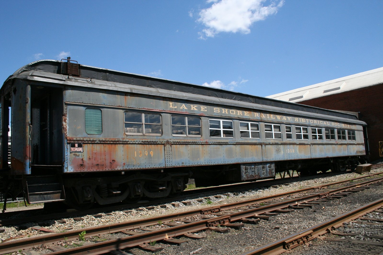 an old train car is sitting on a rail