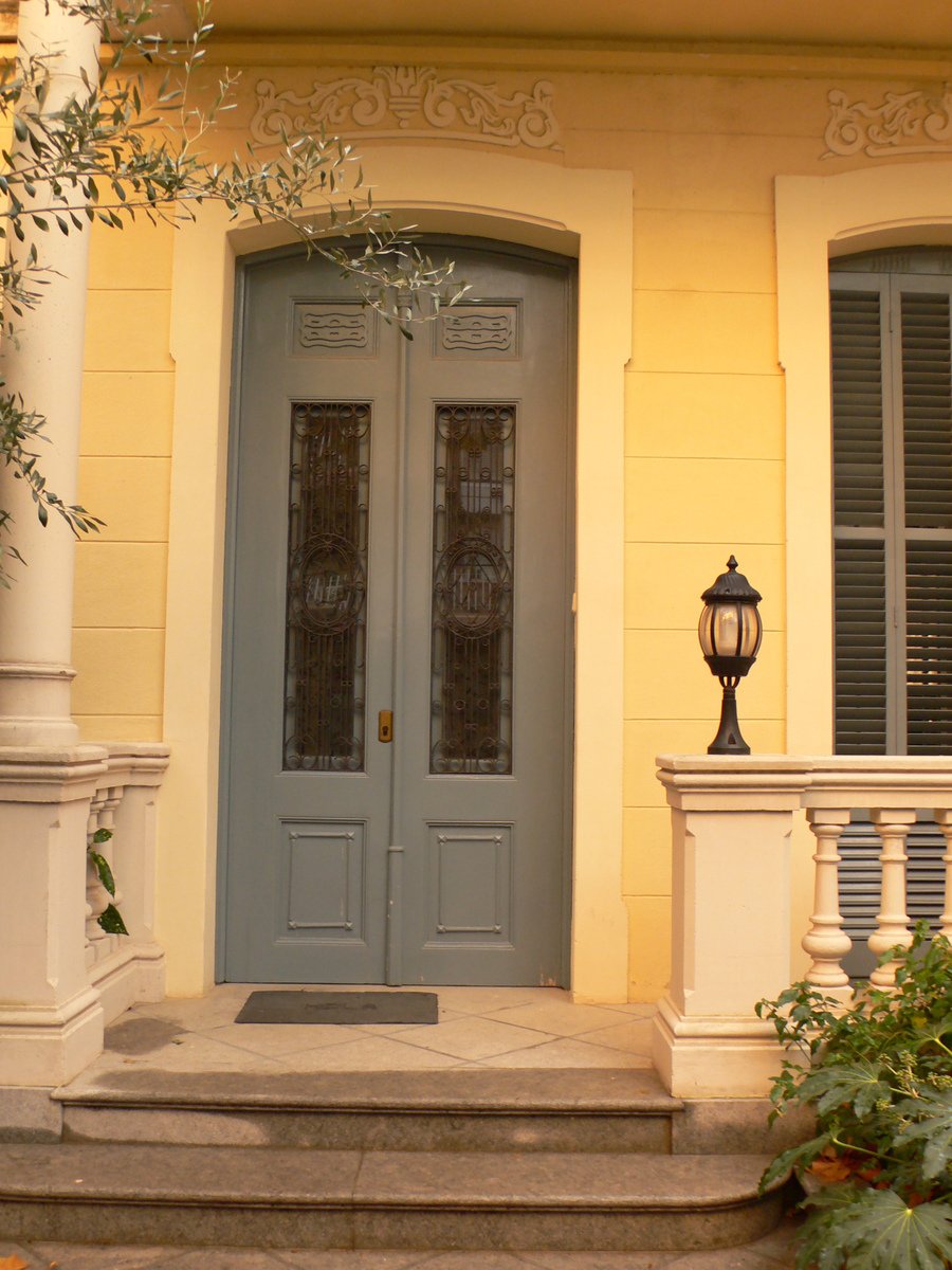 the house has two identical doors with two sidelights