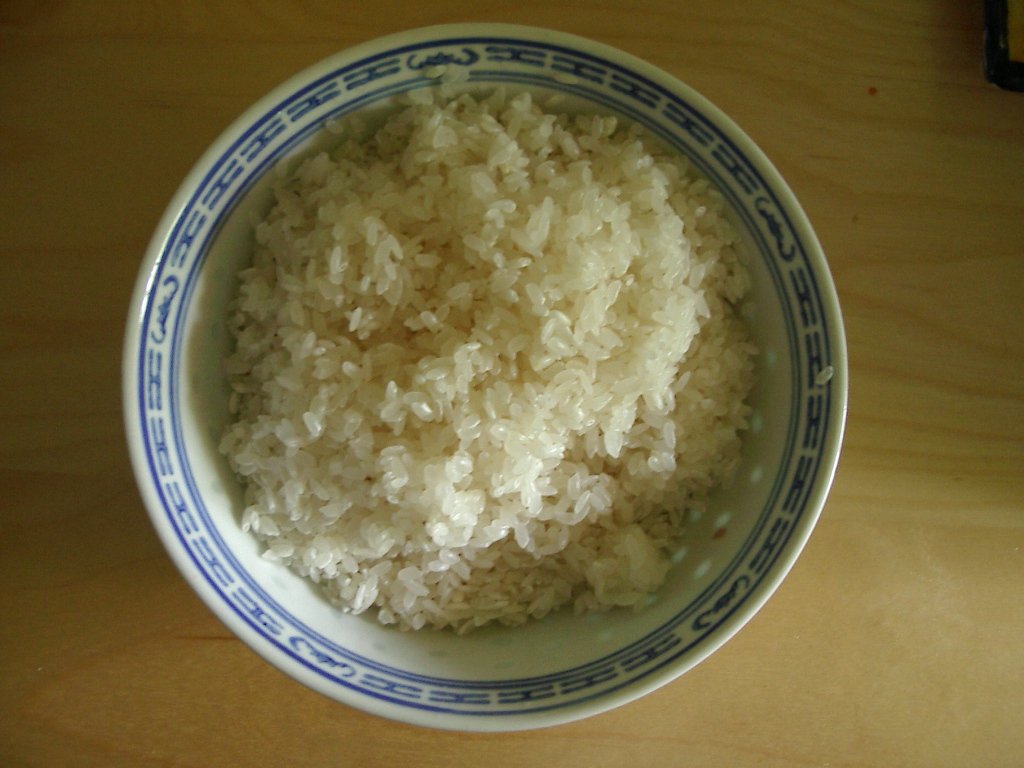 a bowl with cooked white rice in it