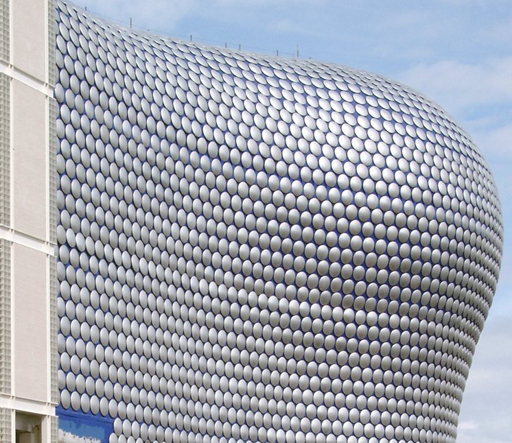 a big building with lots of circles on the front