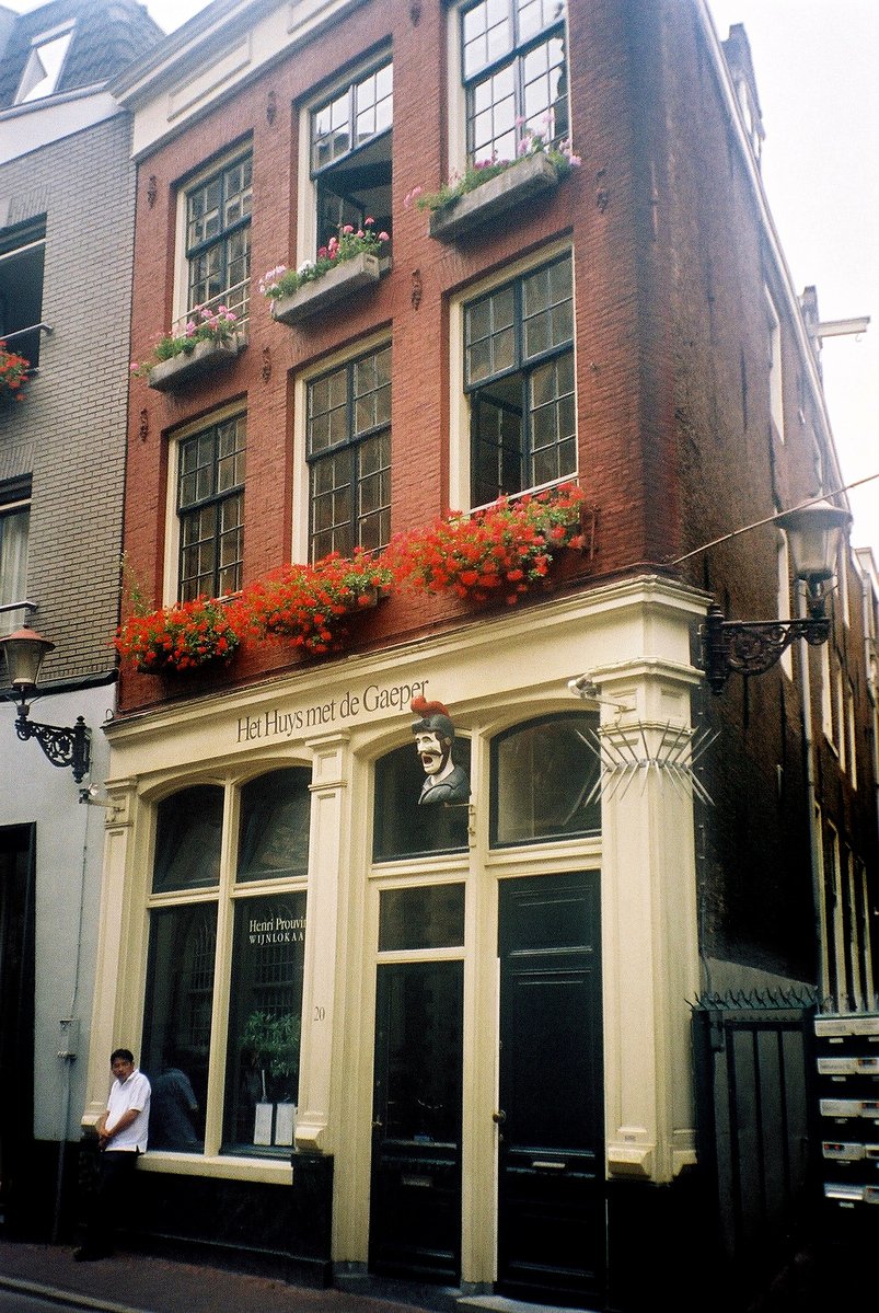 an exterior s of a building with flowers growing from the windows