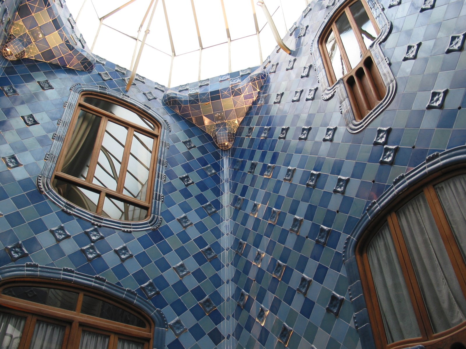 the building is covered in beautiful blue tile