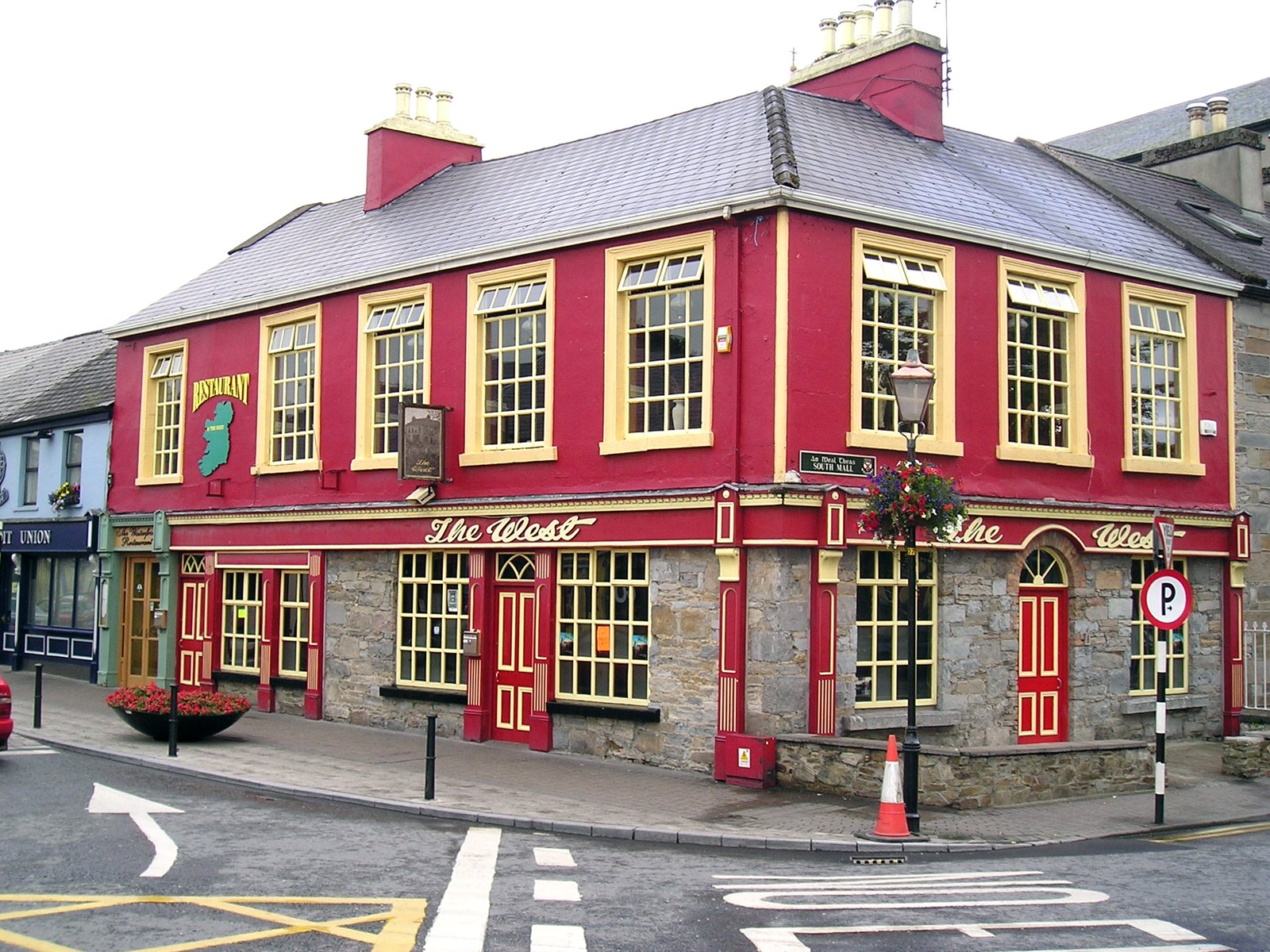 a red building with many windows on the side
