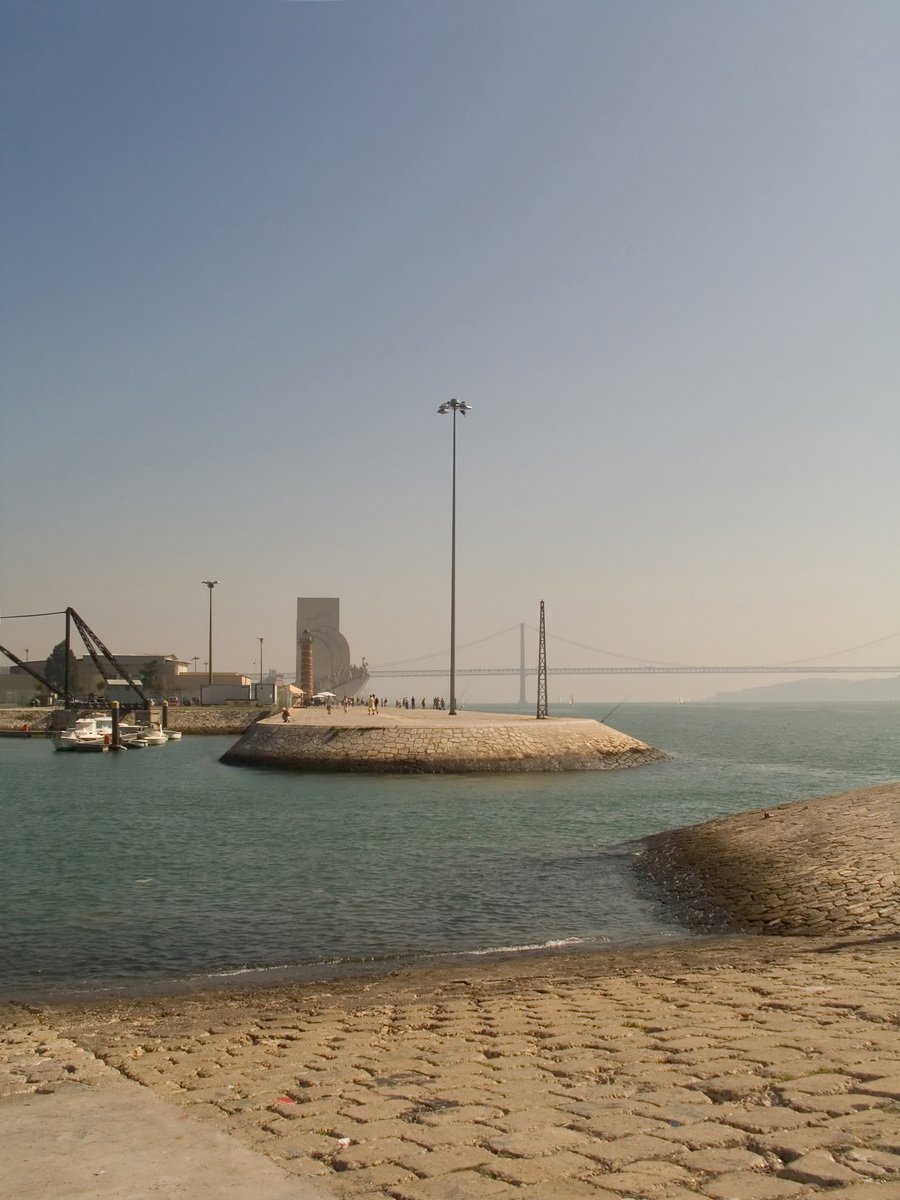 a beach that has a couple boats floating in it