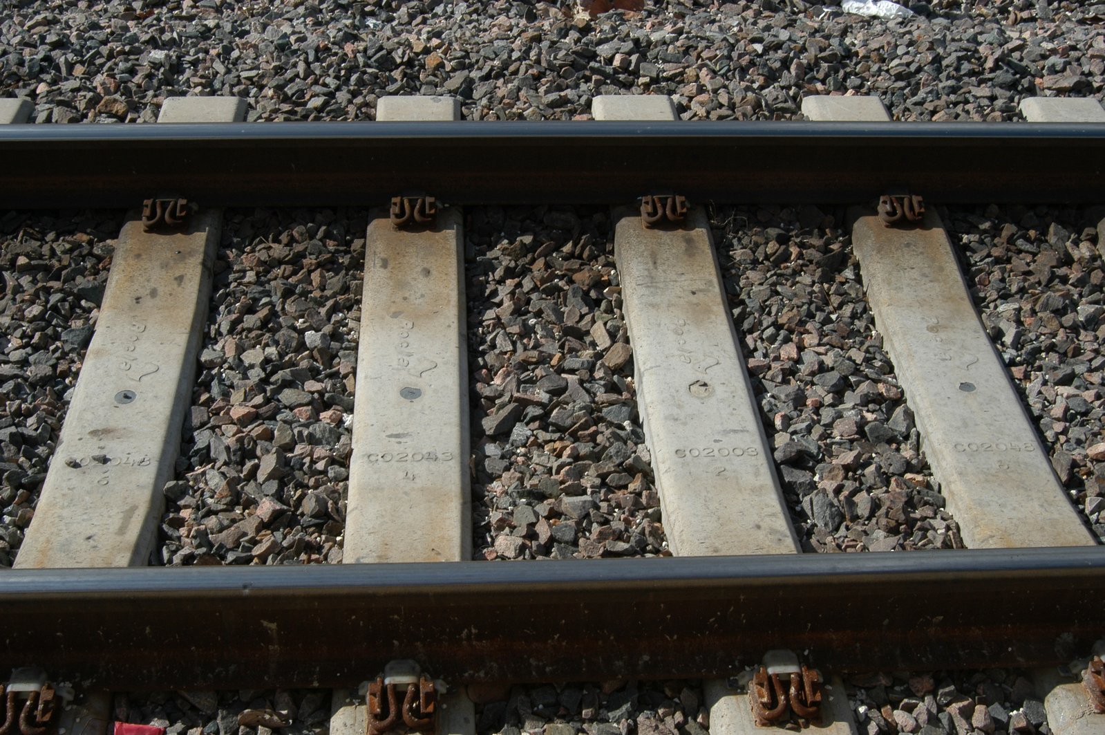 a train track with four wooden tracks running between it